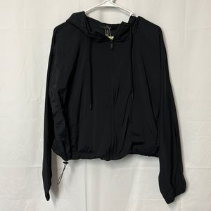 All in motion women’s nylon and spandex windbreaker with two pockets.